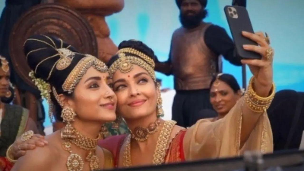 Trisha Krishnan poses with Aishwarya Rai Bachchan on 'Ponniyin Selvan' set. Actress Trisha Krishnan posed with Aishwarya Rai Bachchan for a picture on the sets of their upcoming film 'Ponniyin Selvan', directed by Mani Ratnam. Trisha took to her Instagram, where she and Aishwarya are seen taking a selfie on the sets dressed in their costumes from the upcoming magnum opus. Read full story here